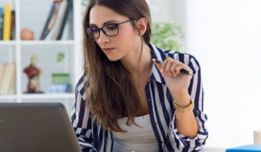 girl using laptop and iphone