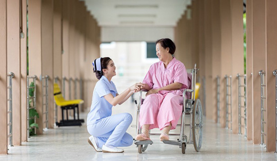 Senior assists by nurse