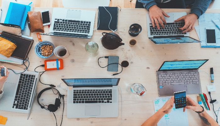 multiple laptops on the table