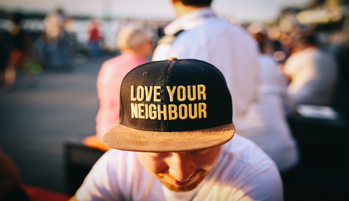 Love your neighbor tag on the cap