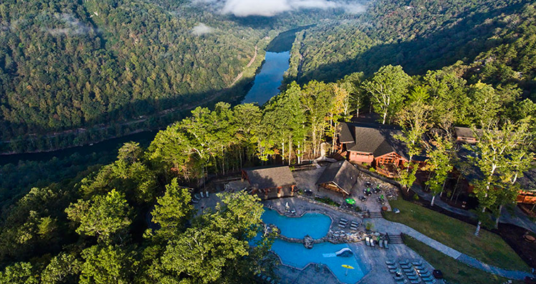 Aerial view of a resort in the middle of the forest