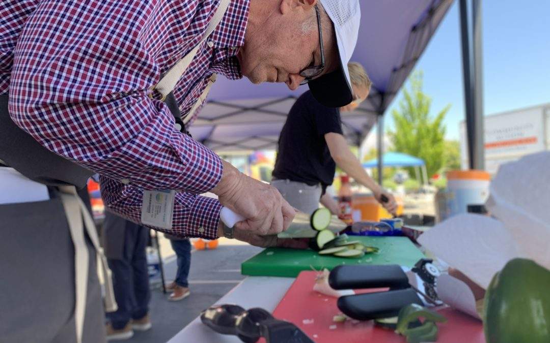 Old man chopping veggies