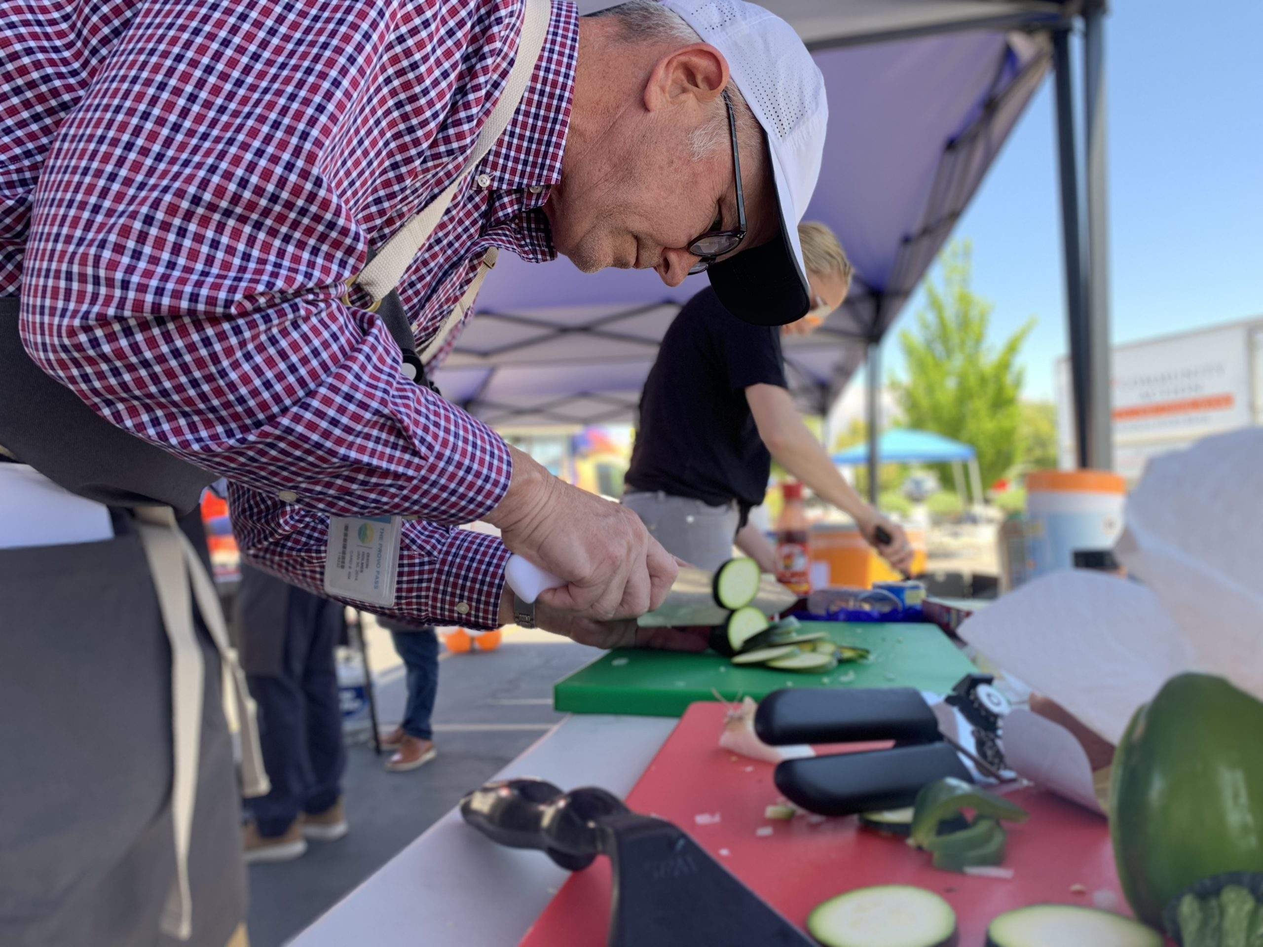 Old man chopping veggies